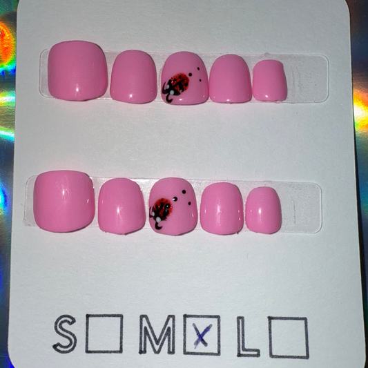 Children’s Bright Light Pink Press-On Nails with Ladybug Accent – Size Medium