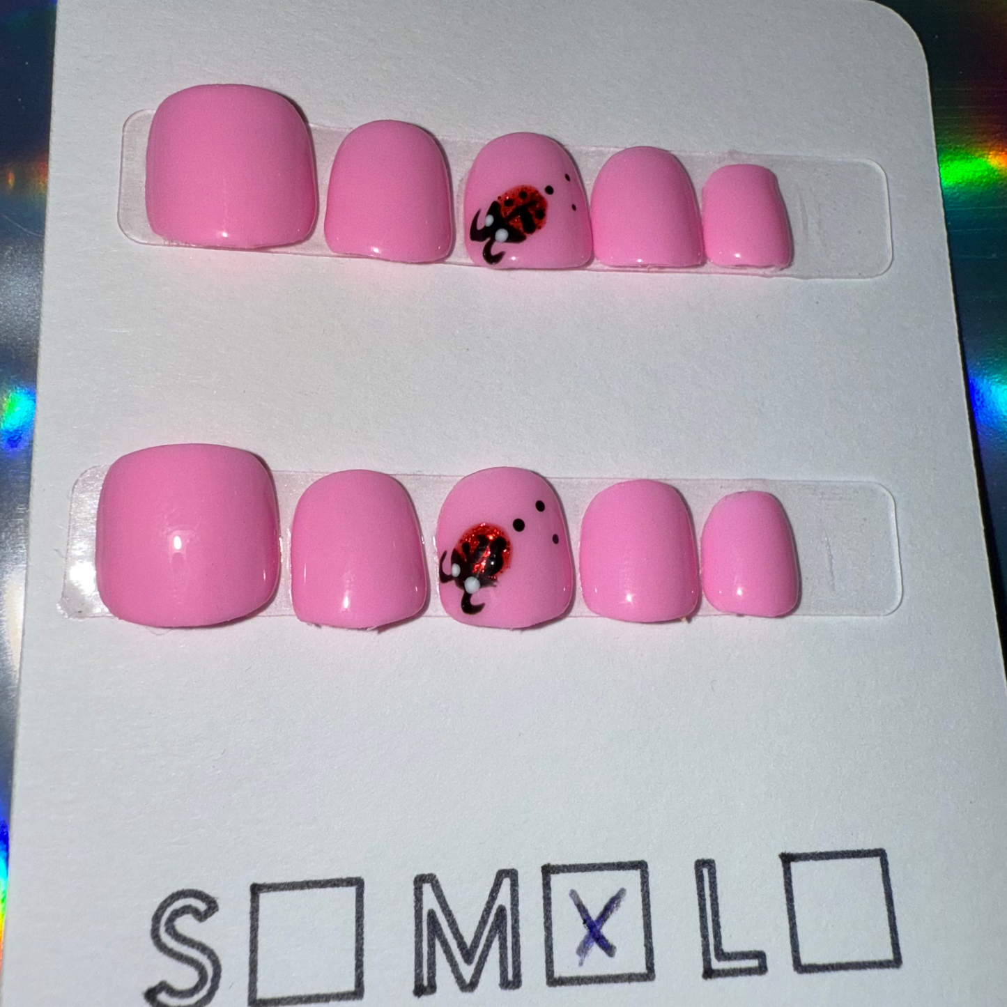 Children’s Bright Light Pink Press-On Nails with Ladybug Accent – Size Medium