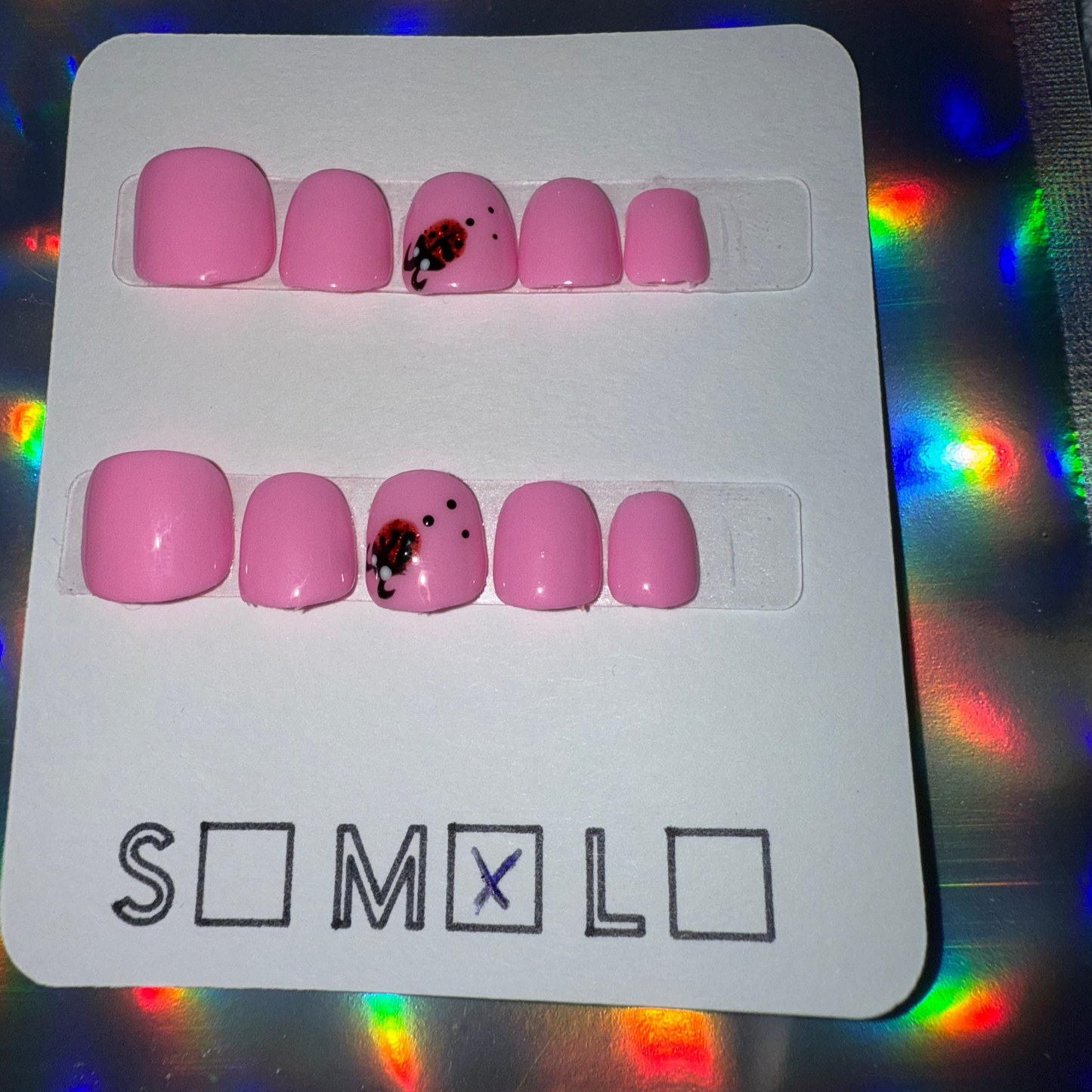 Children’s Bright Light Pink Press-On Nails with Ladybug Accent – Size Medium